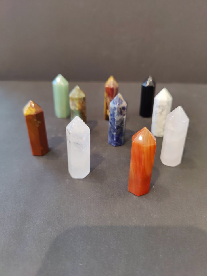 Multicolor crystal tower sculpture set with faceted tops and pointed bases