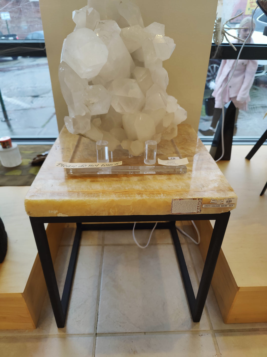 Wood and black metal nesting table with rectangular top and crystal display on surface