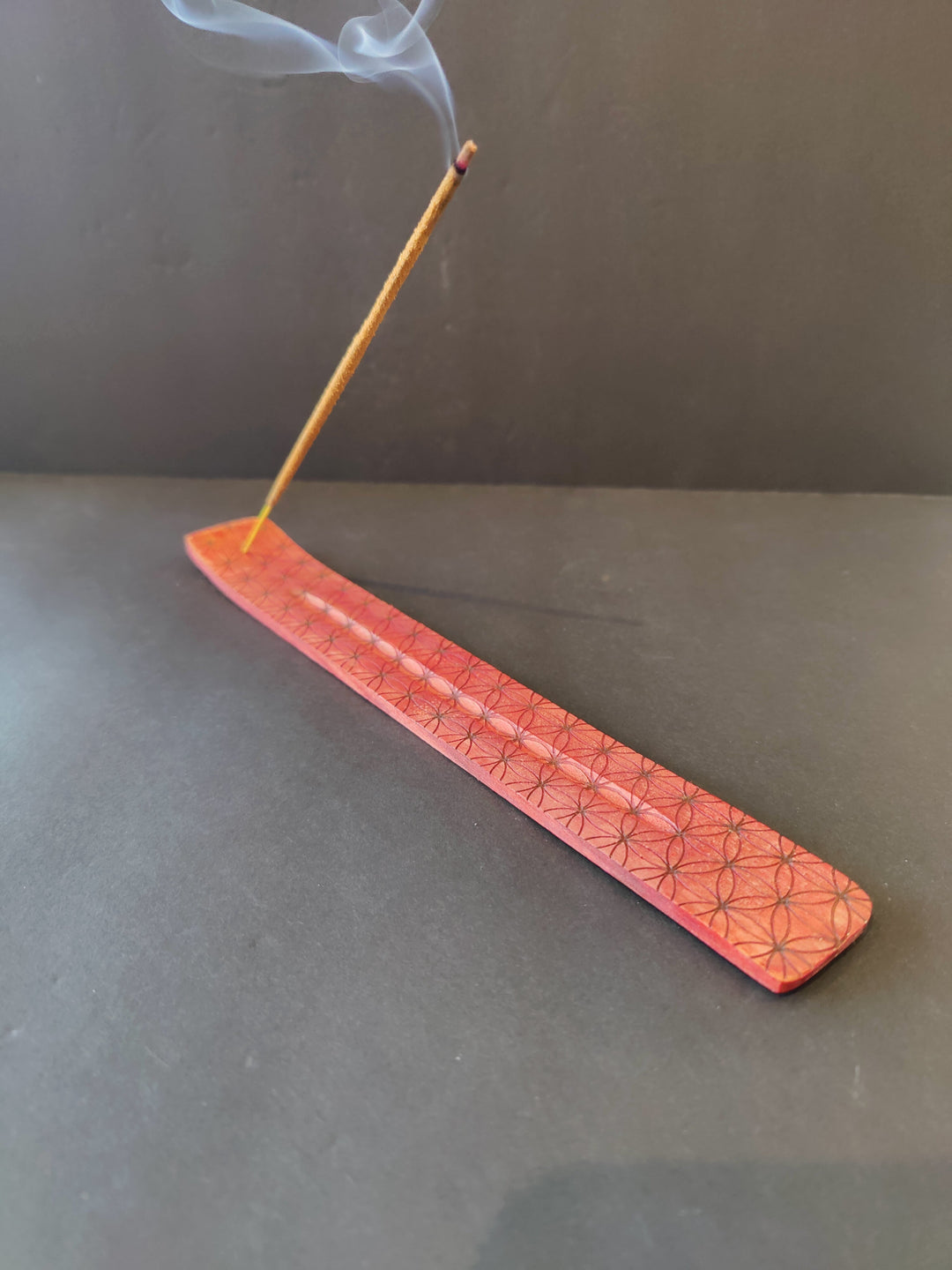 Red wood incense burner with geometric print, long flat tray with smoking incense