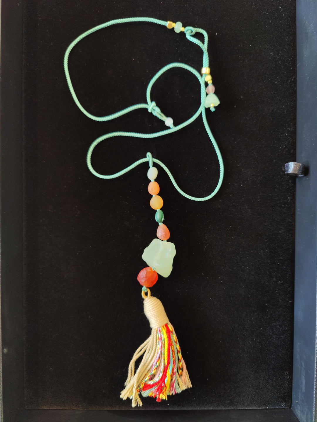 Colorful agate bead pendant necklace with green cord and multicolor tassel