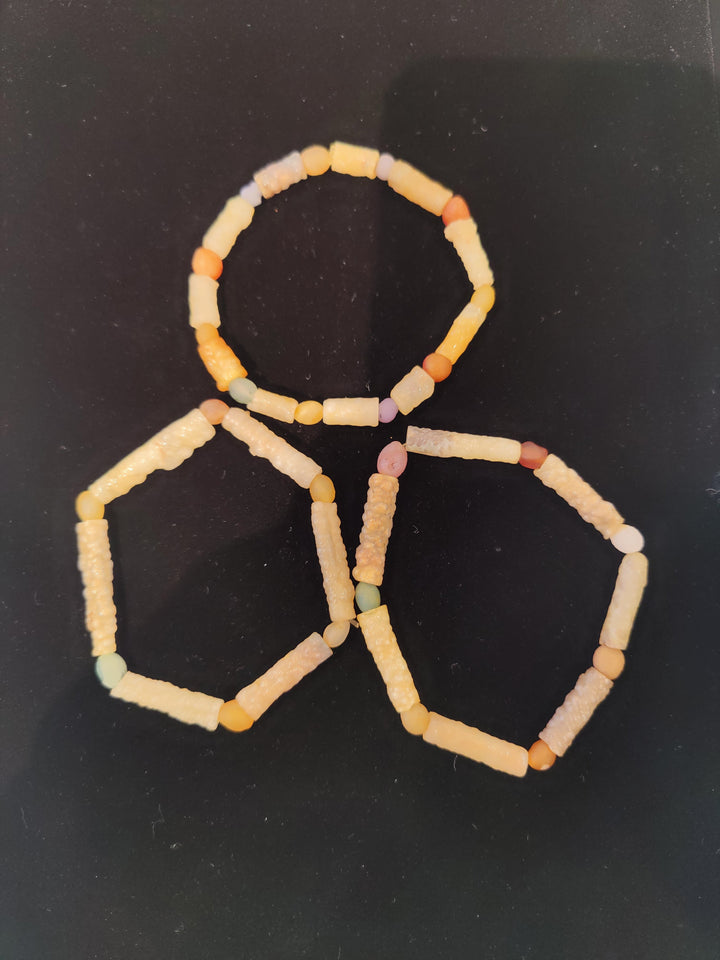 Cream and peach beaded agate bracelet with rectangular tube-style beads