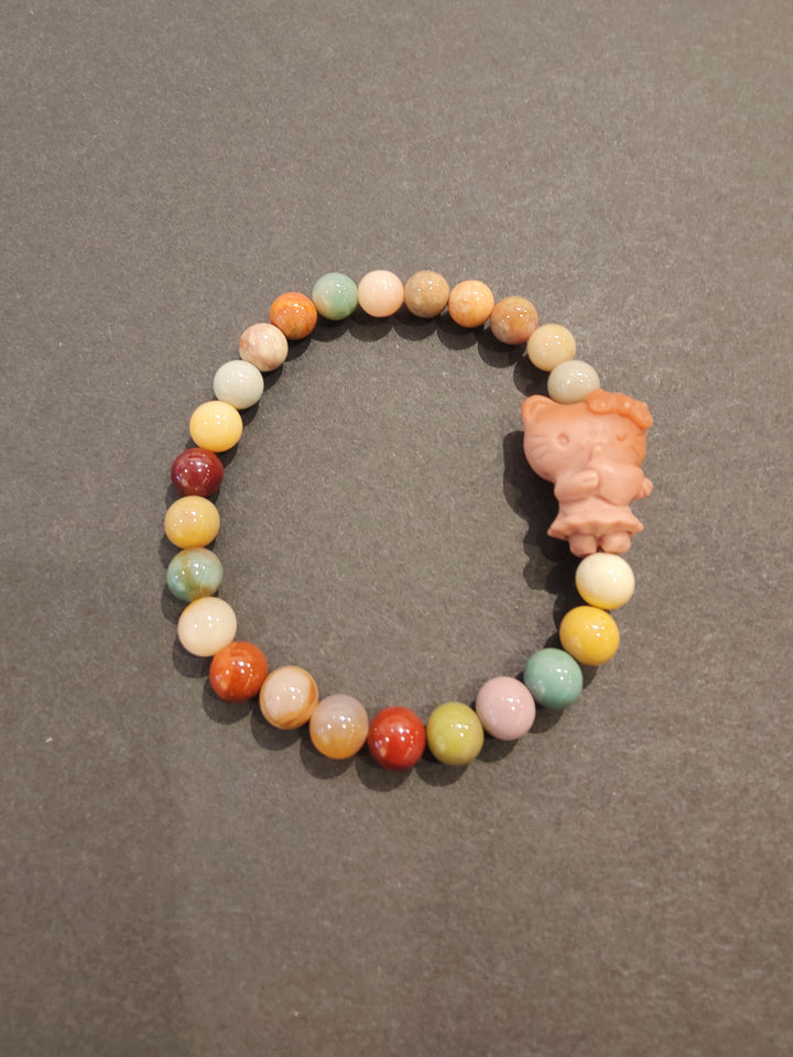 Multi-color bead bracelet with pink animal figurine charm