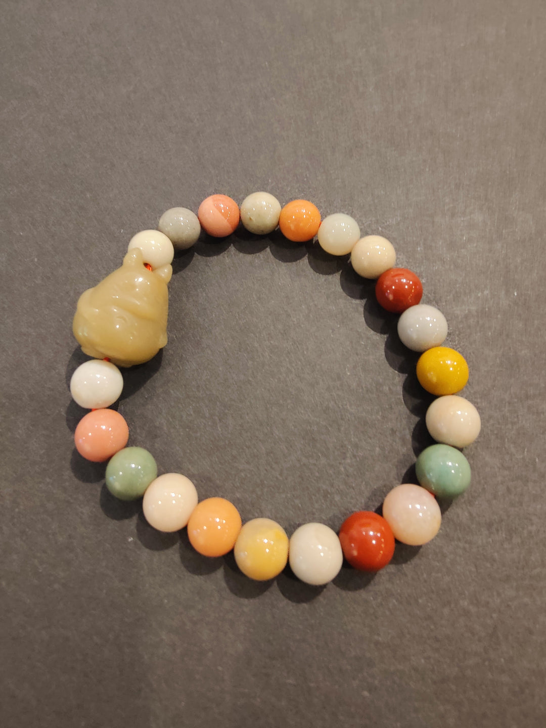 Elephant charm multi-color bead bracelet with round pastel beads