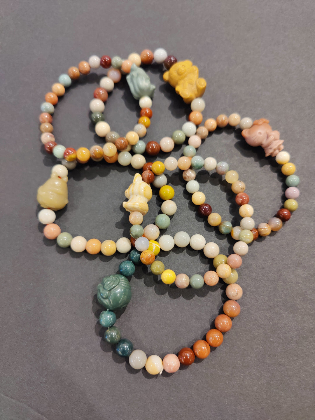 Multi-color bead bracelet with assorted animal charms