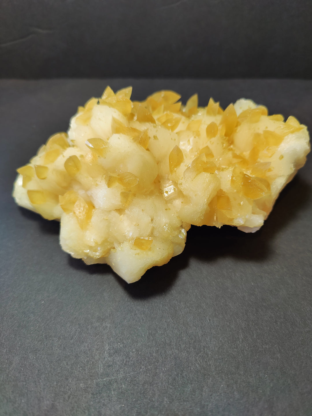 Golden calcite crystal cluster with mixed yellow and off-white crystalline mineral