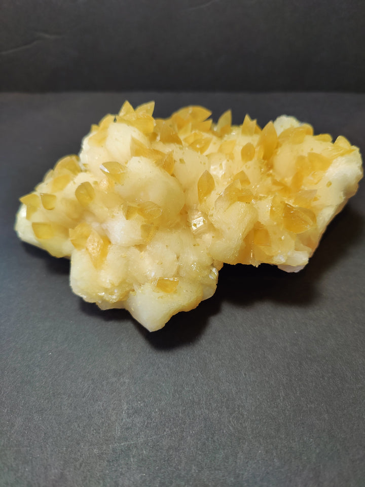 Golden calcite crystal cluster with mixed yellow and off-white crystalline mineral