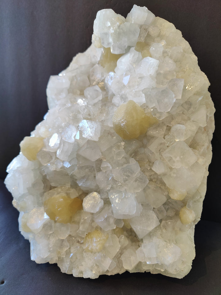 Apophyllite and stilbite crystal cluster with translucent white and amber-yellow crystals