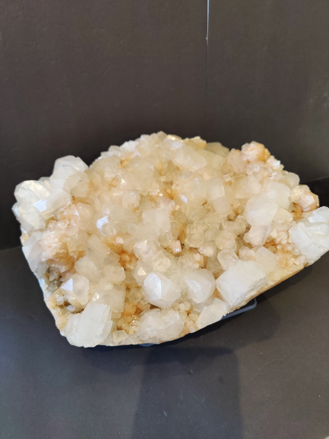 Mineral crystal cluster specimen, clear white with light peach crystal highlights