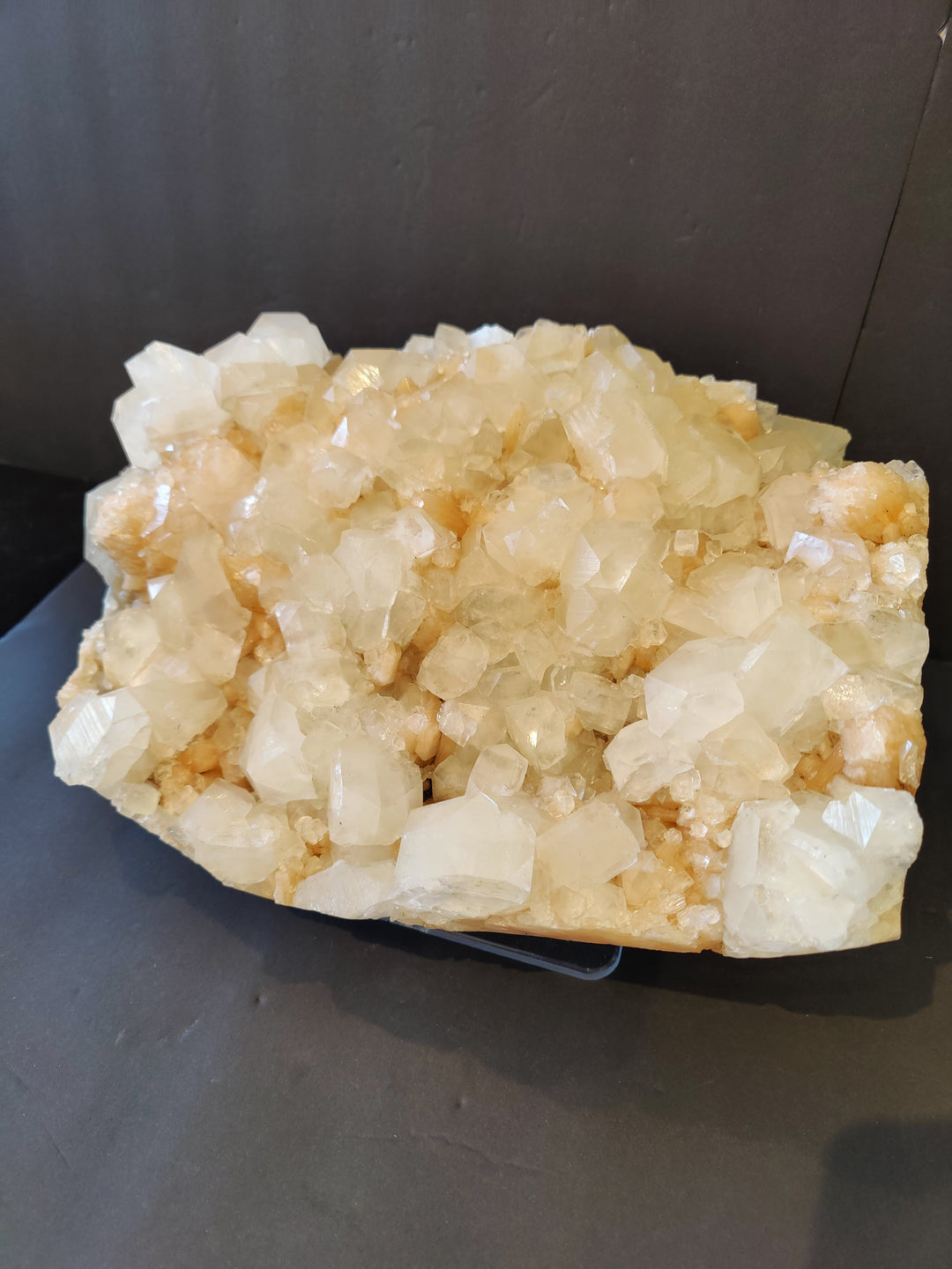 Mineral crystal cluster specimen with clear white and warm peach crystal matrix