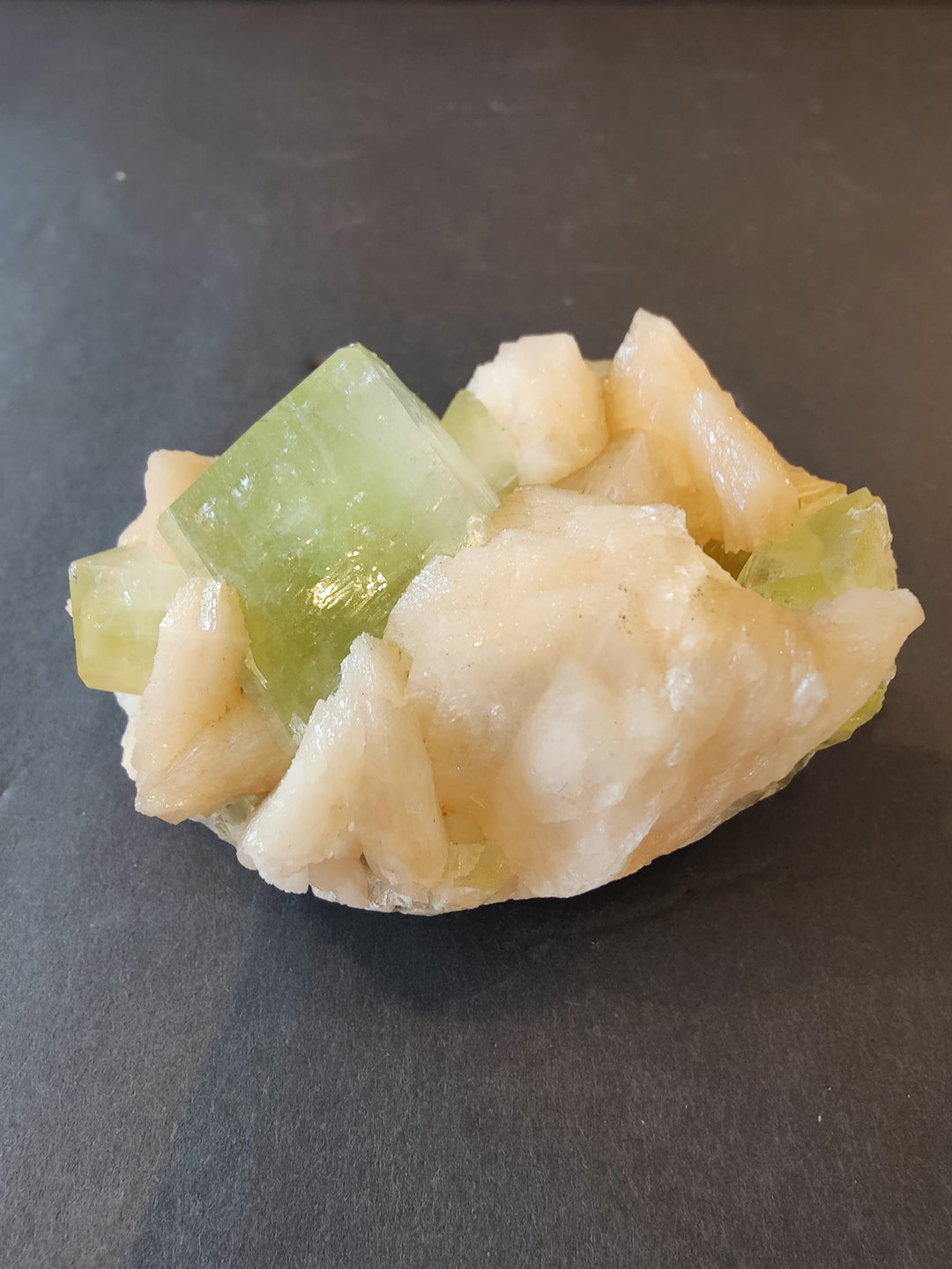 Peach and cream crystal cluster with pale green cube crystals