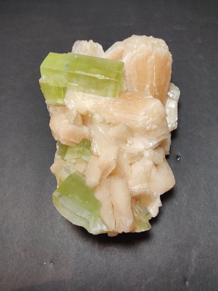 Green apophyllite cubes on creamy peach stilbite crystal matrix