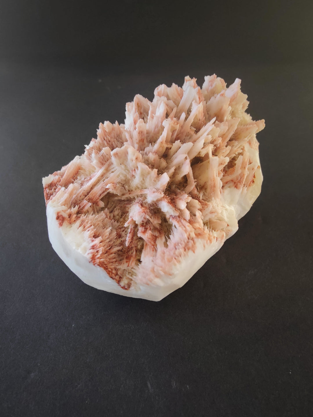 Mordenite and stilbite mineral specimen, peach and white crystal spikes on rock
