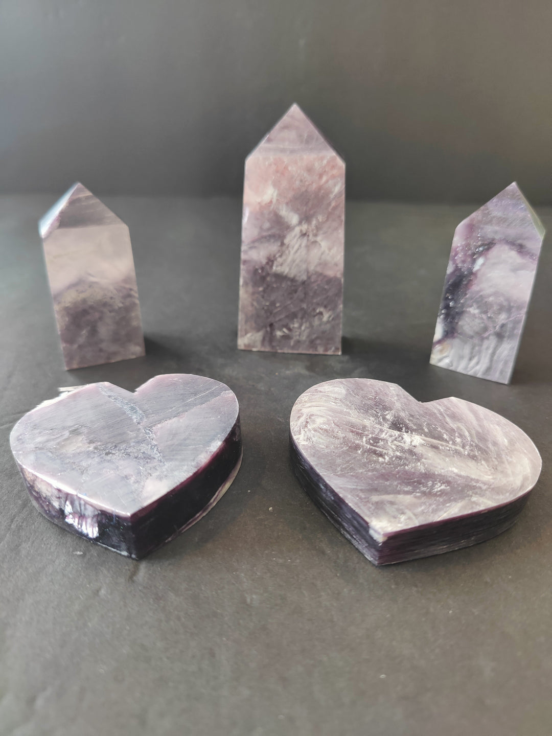 Lepidolite crystal set with three tower sculptures and two heart sculptures