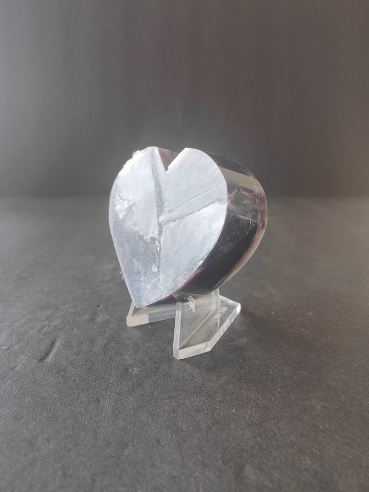 Lepidolite heart sculpture in white with gray and purple veining on clear stand
