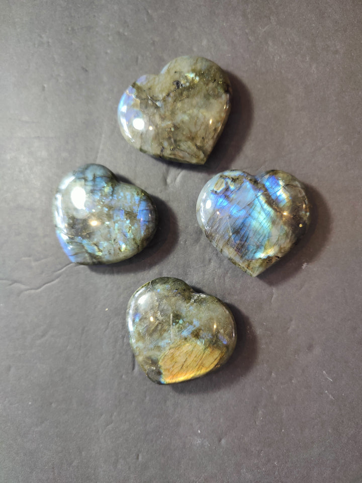 Polished labradorite heart with green-gold base and bright blue iridescent flash
