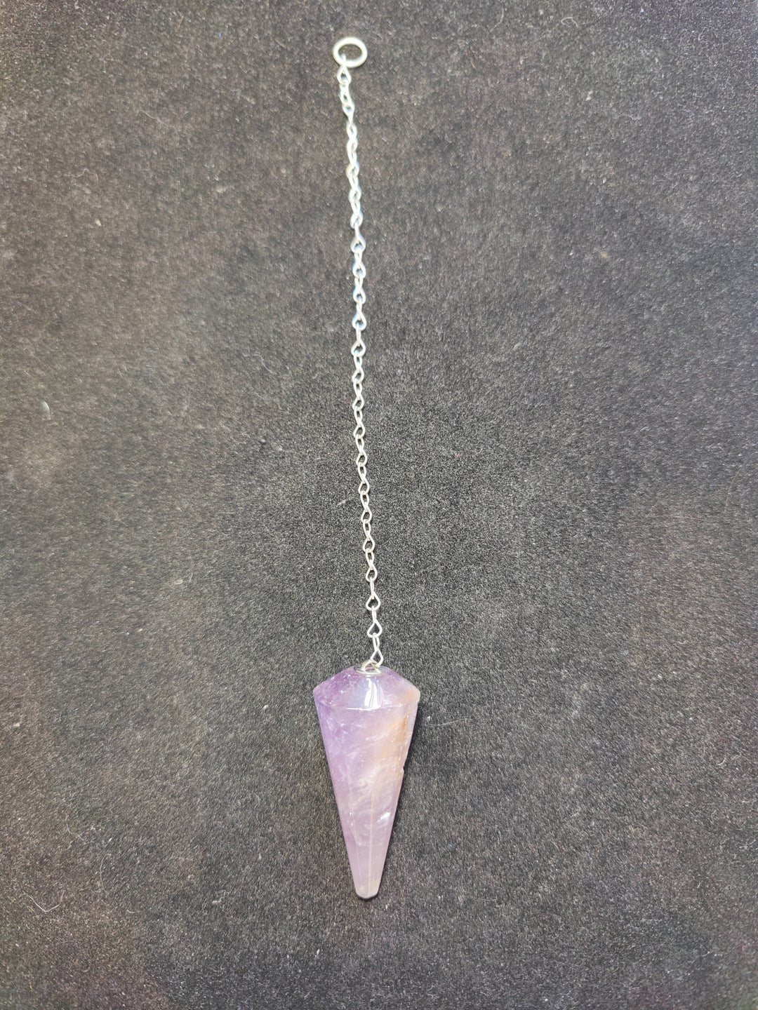 Purple stone pendulum on silver chain with round clasp ring