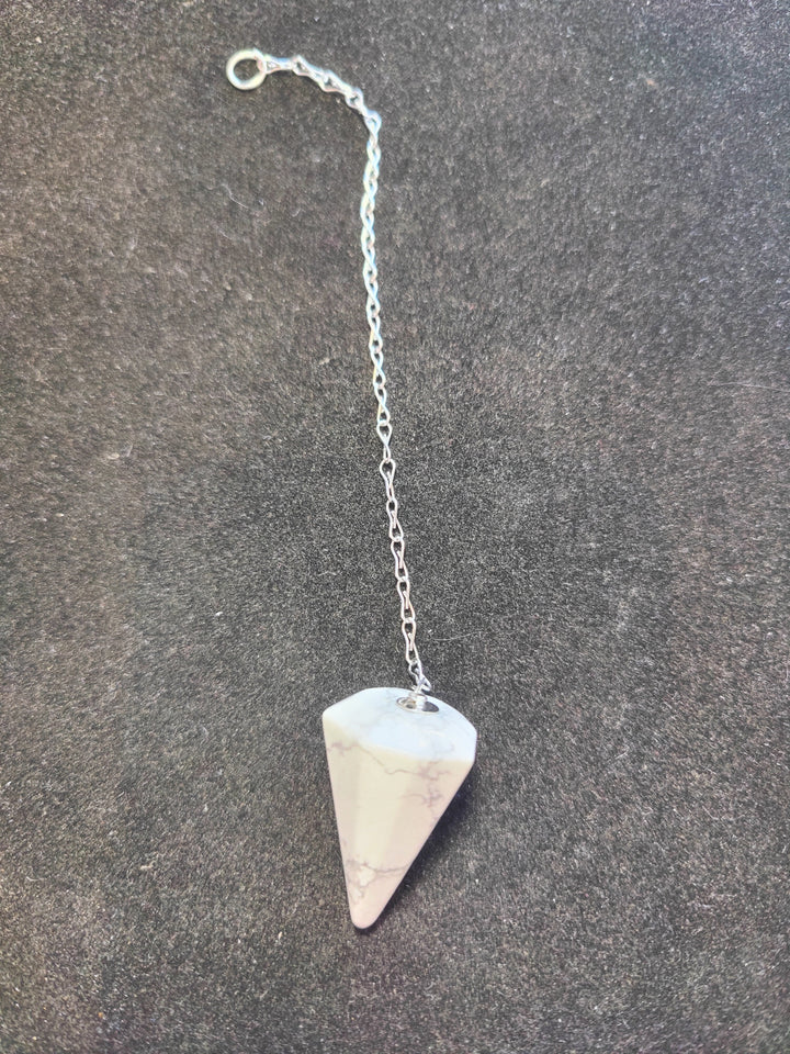 White and pale pink stone pendulum on silver chain with round clasp ring