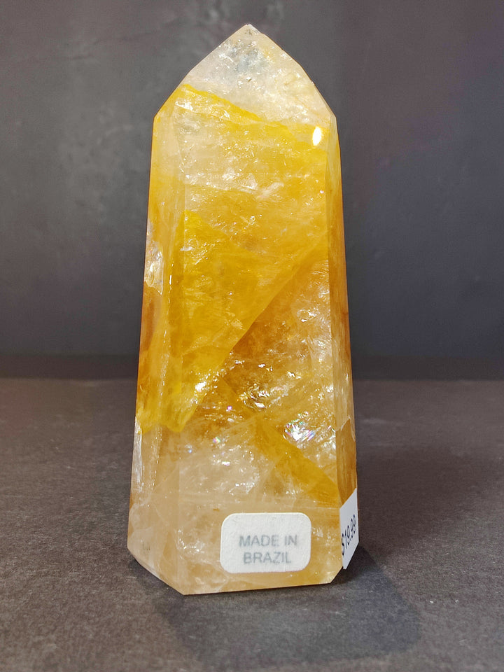 Polished yellow and white quartz obelisk tower sculpture, glossy crystal faces