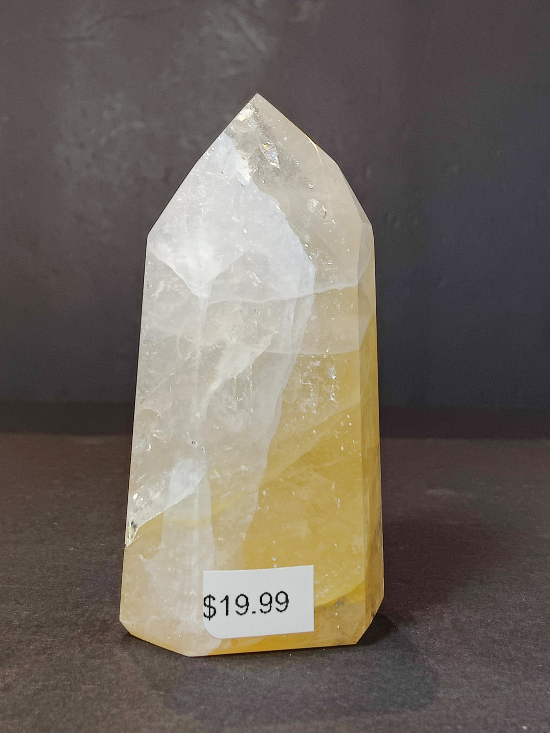Polished white and pale yellow quartz obelisk tower sculpture with pointed tip