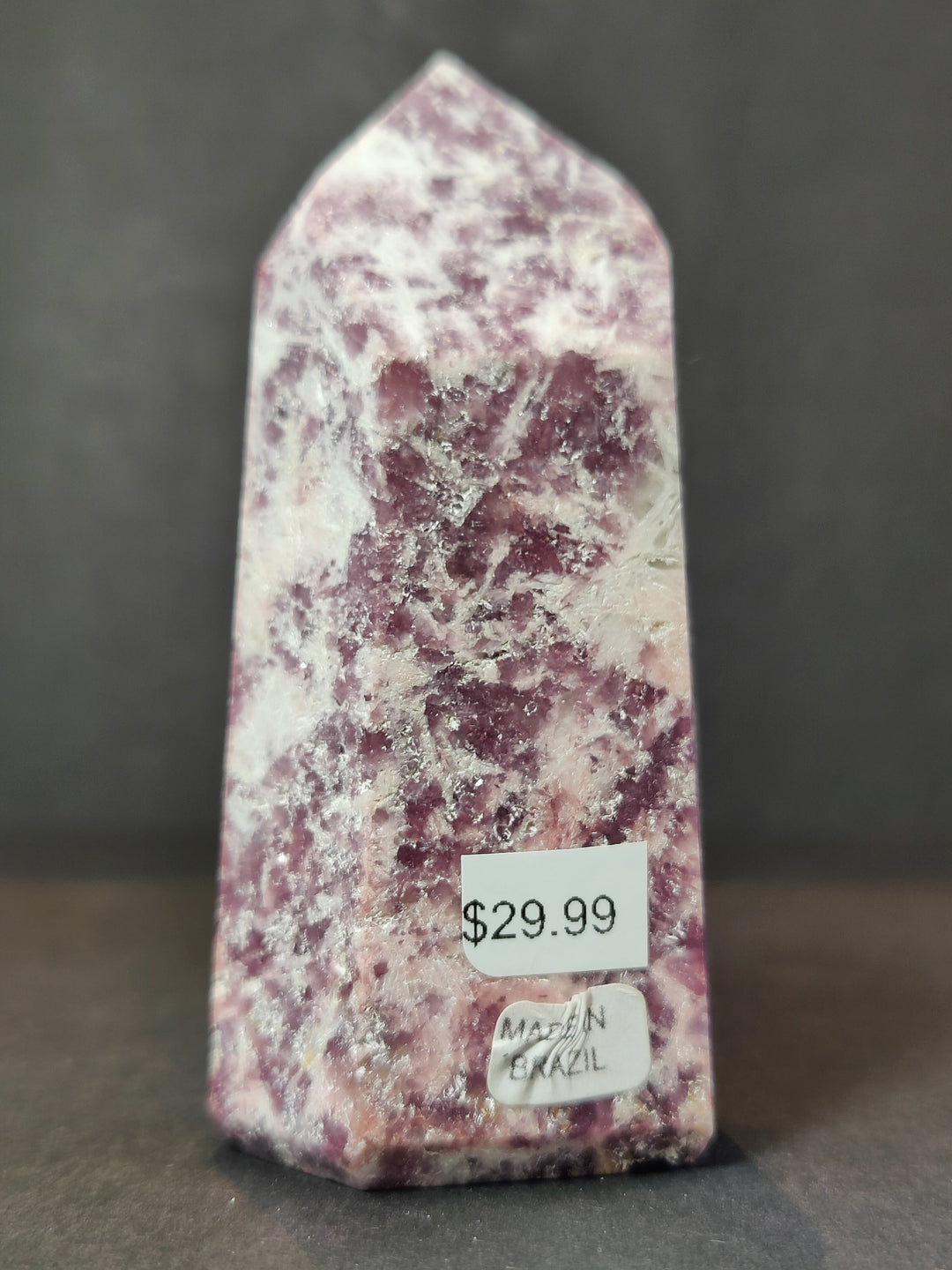 Polished lepidolite tower sculpture, purple speckled with white veining
