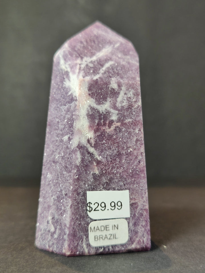 Polished lepidolite tower sculpture, deep purple with light white patterns