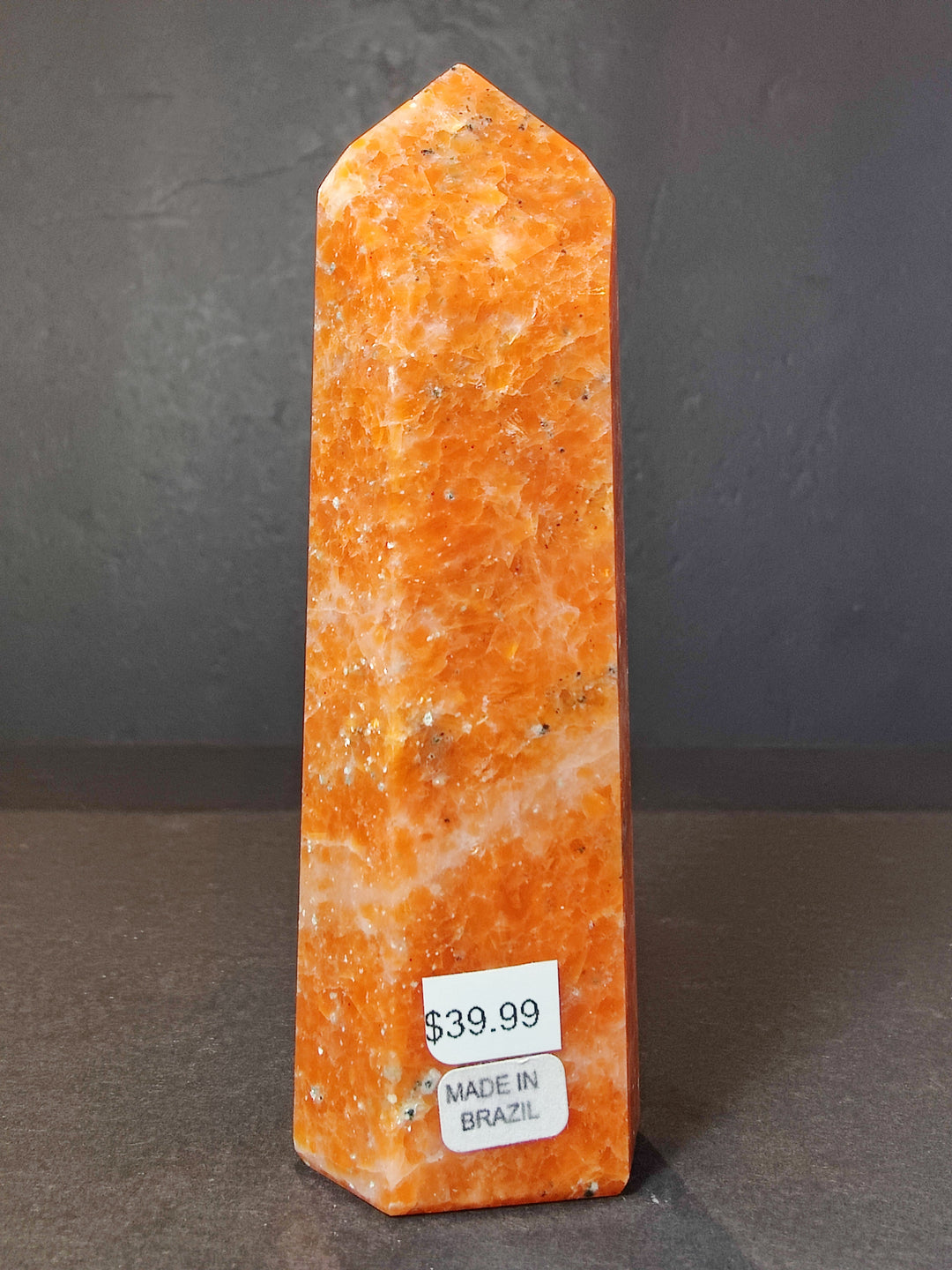 Polished sunstone obelisk tower sculpture, orange crystal with &