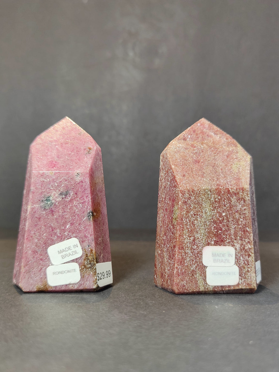 Polished rhodochrosite obelisk tower sculpture, pink and rose stone with polished facets