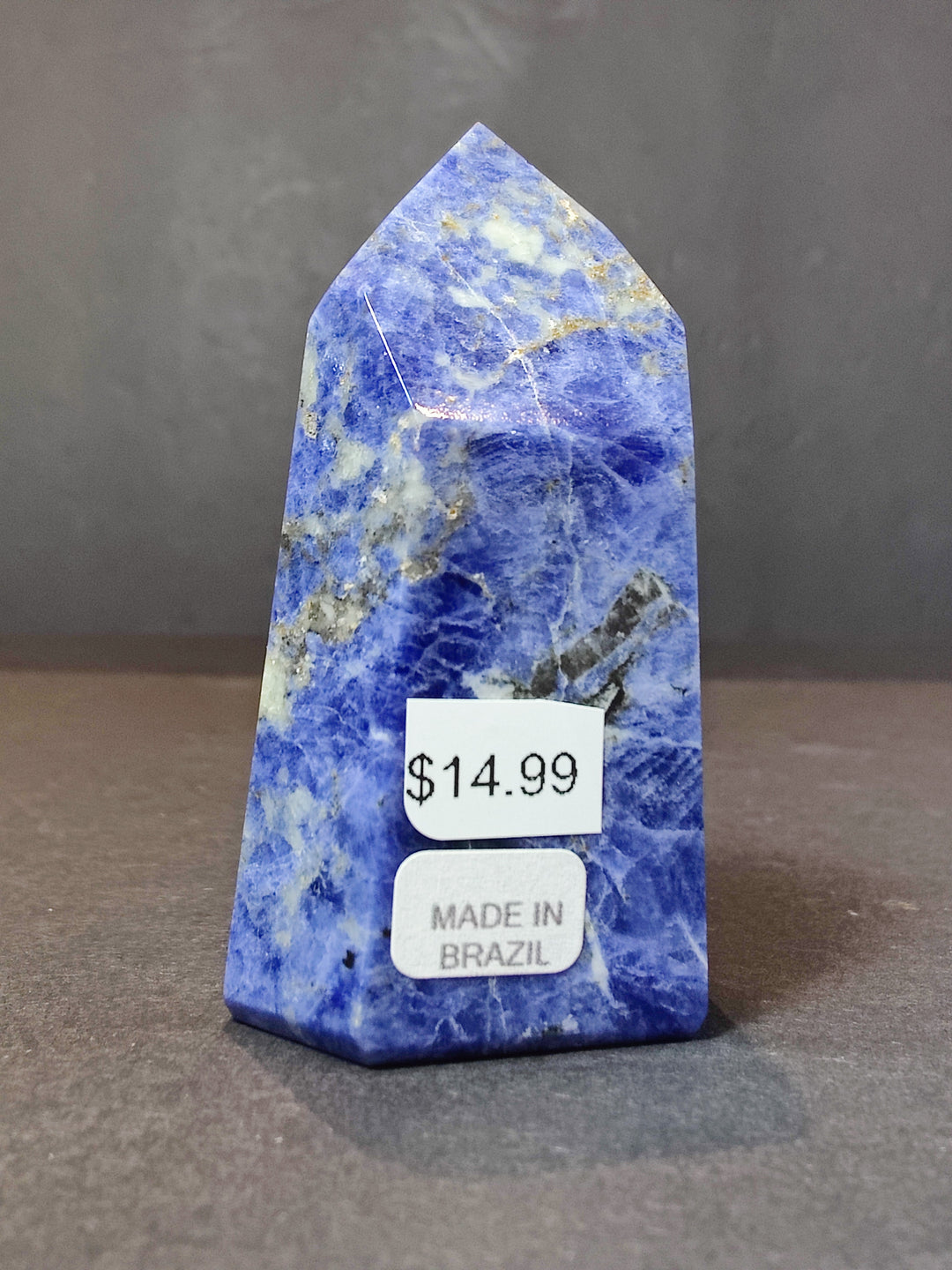 Polished blue sodalite obelisk tower with $14.99 tag, made in Brazil.