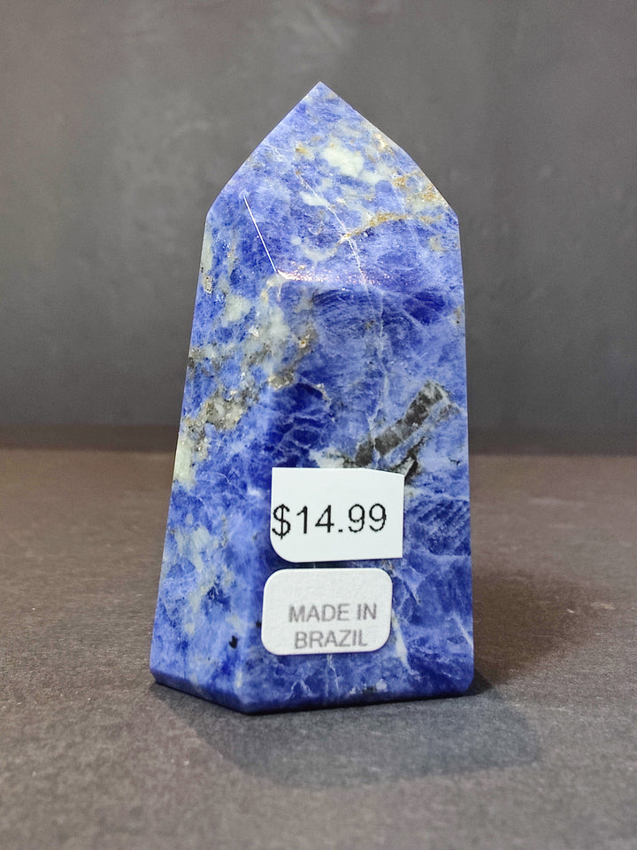 Polished blue sodalite obelisk tower with $14.99 tag, made in Brazil.