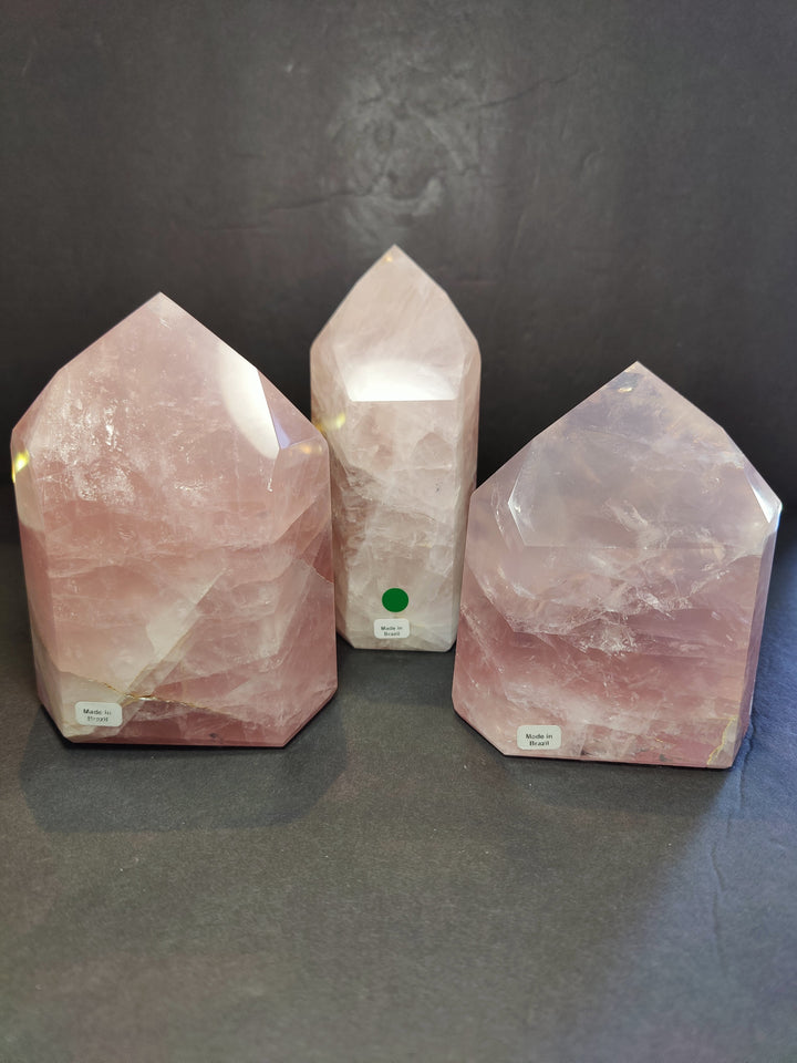 Rose quartz polished obelisk tower sculptures, set of three pink translucent crystal