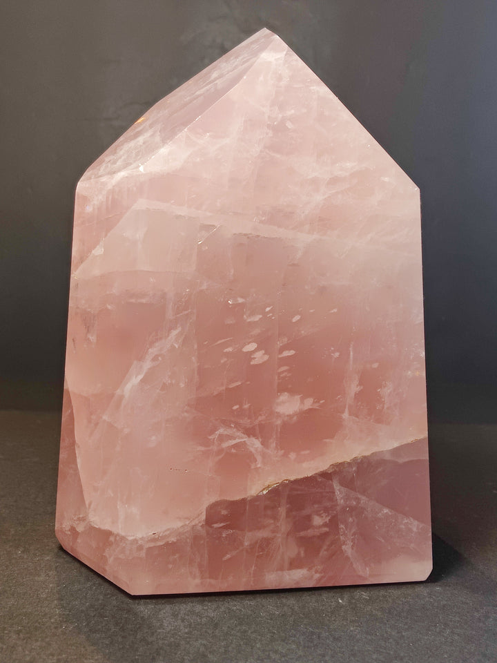 Rose quartz polished obelisk tower, pink translucent faceted crystal