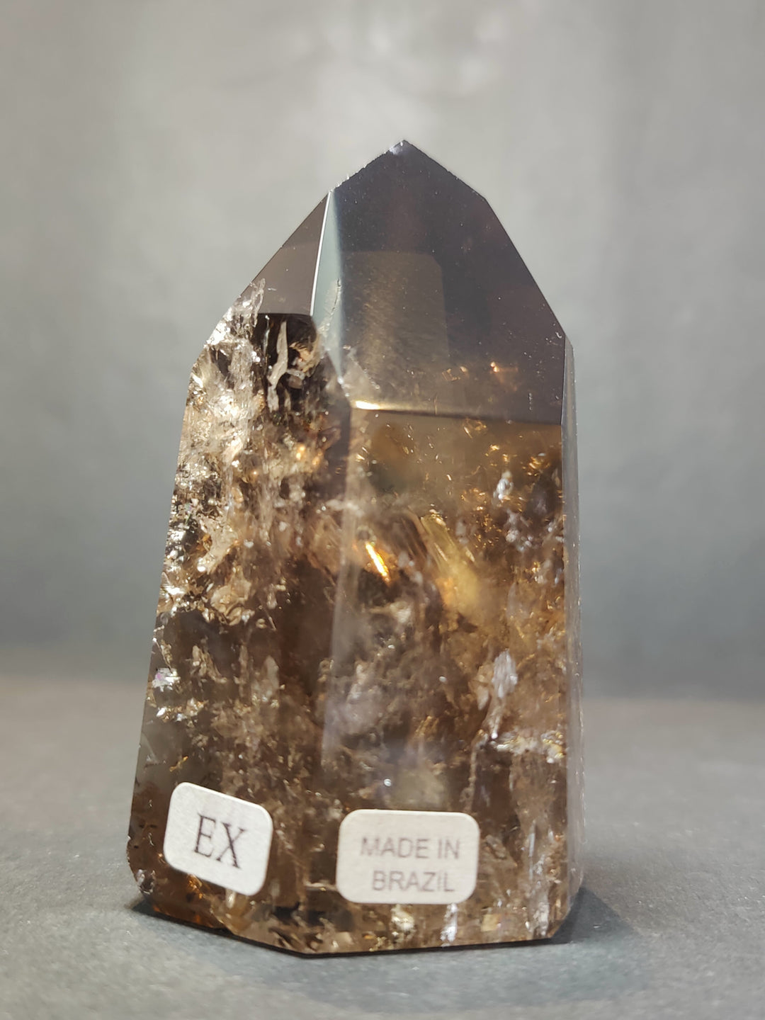 Smoky clear quartz free-form sculpture, polished facets, label: EX and Made in Brazil