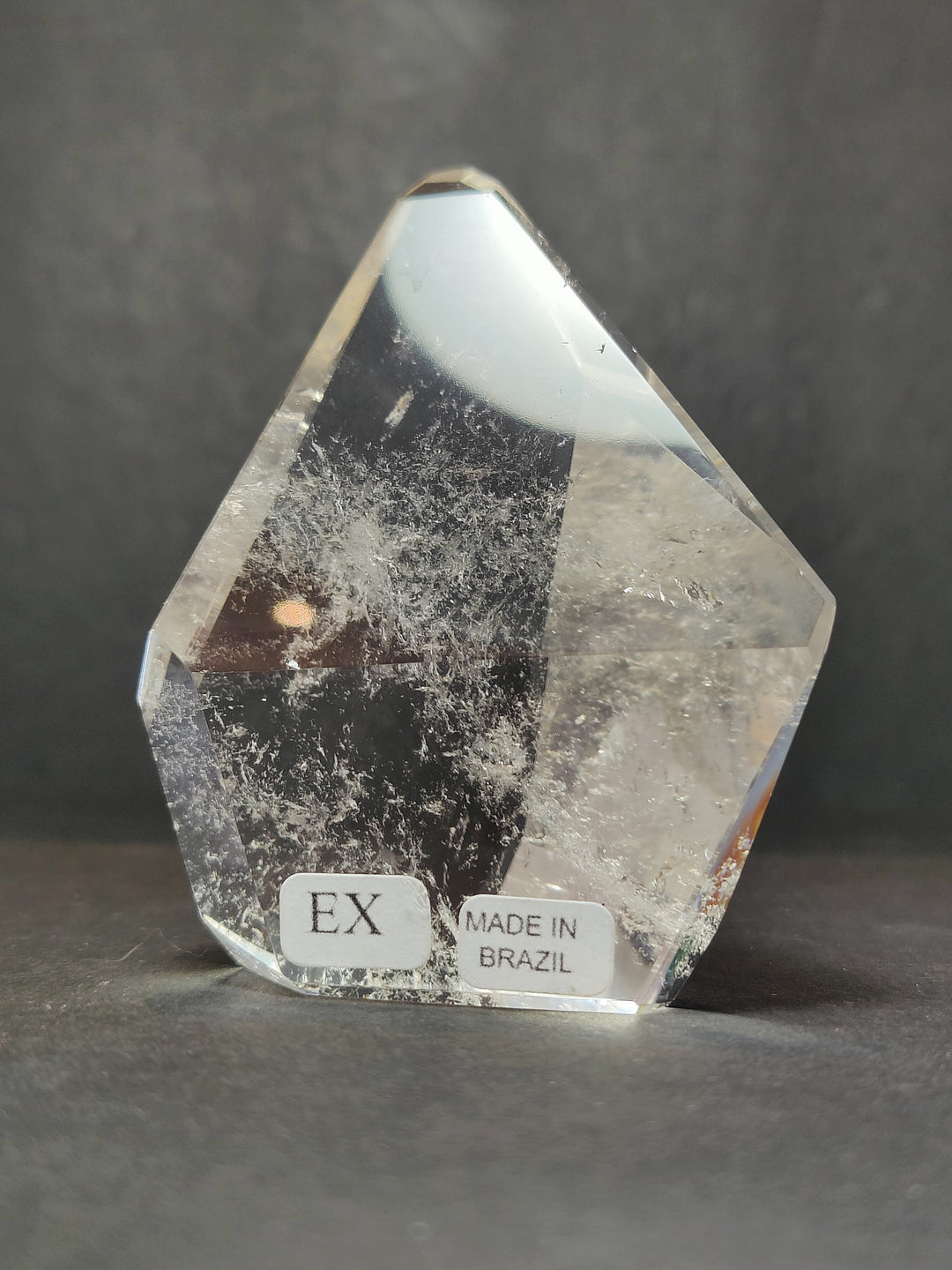 Clear smoky quartz free-form sculpture, polished facets, labels: EX and Made in Brazil