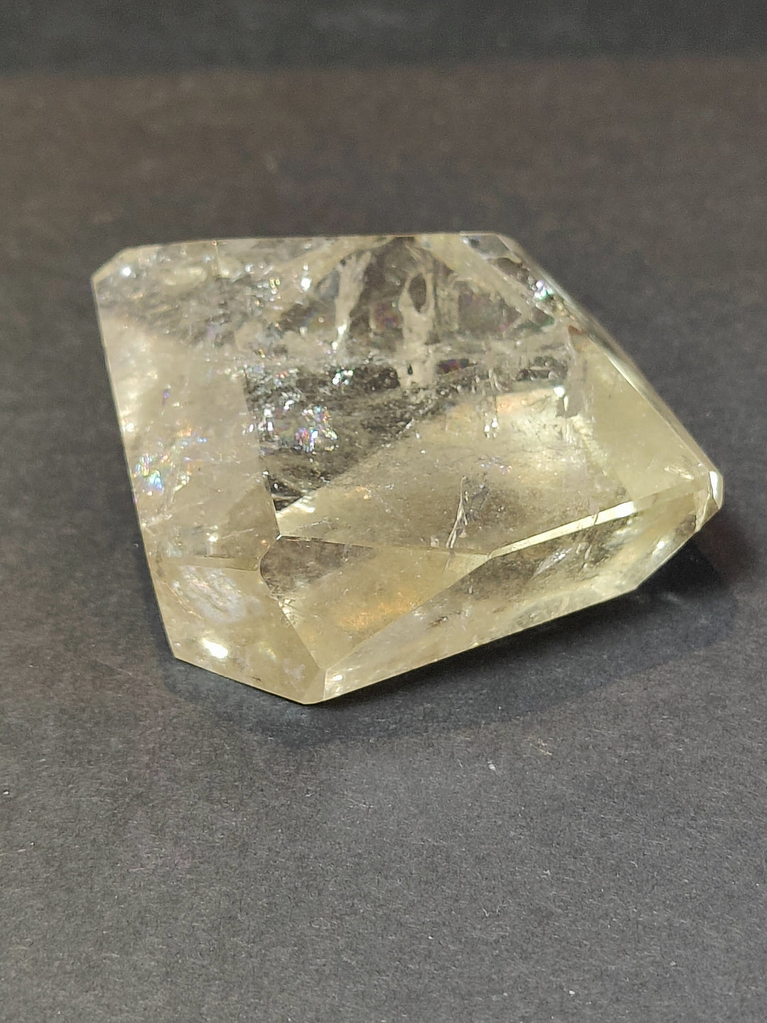 Clear smoky quartz free-form sculpture, polished faceted stone with internal inclusions