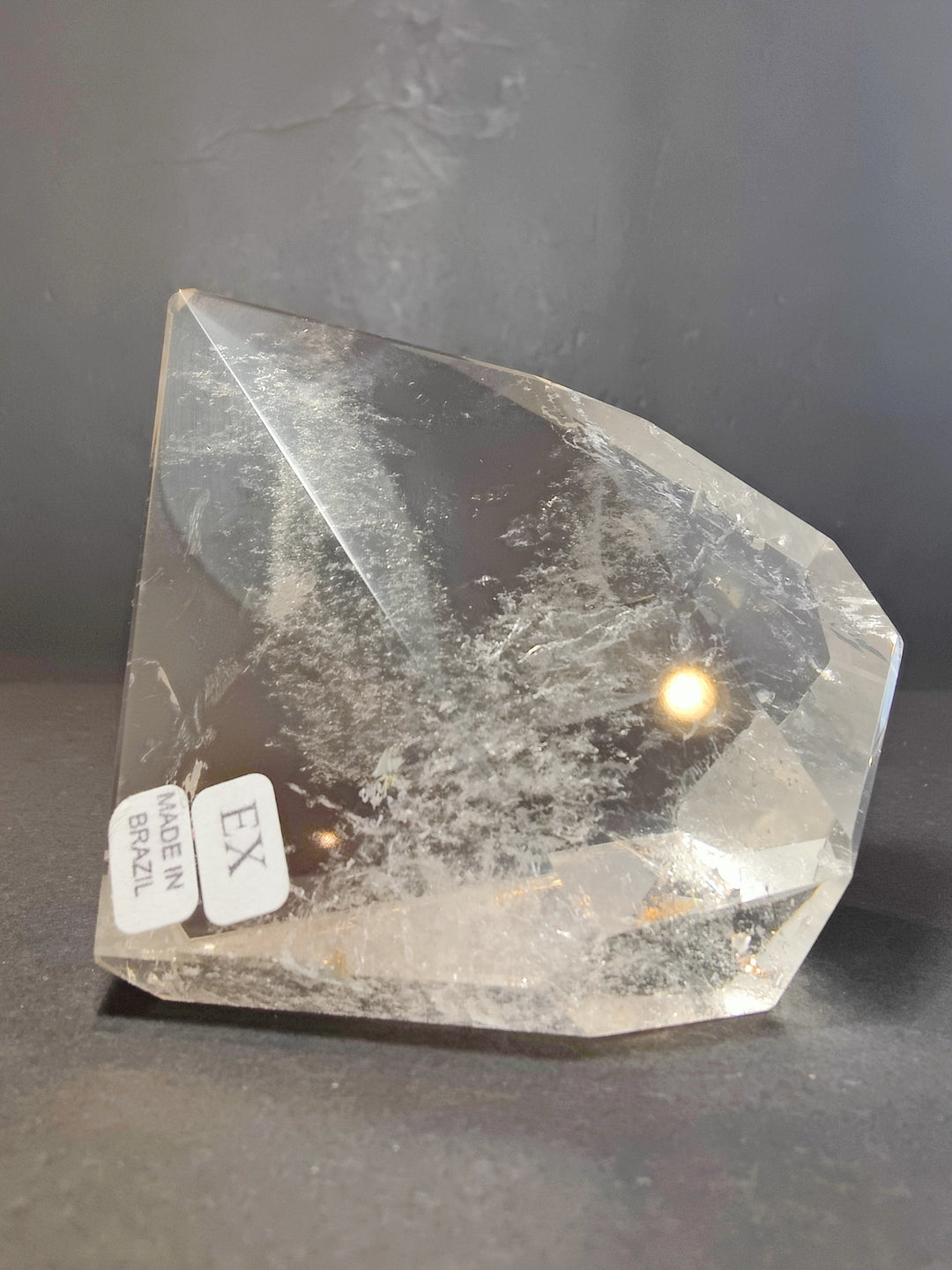 Polished smoky and clear quartz free-form sculpture with faceted, transparent stone