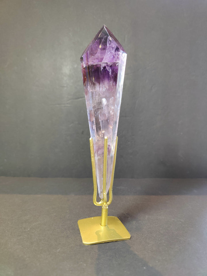 Single amethyst crystal scepter wand on gold metal stand, clear purple top