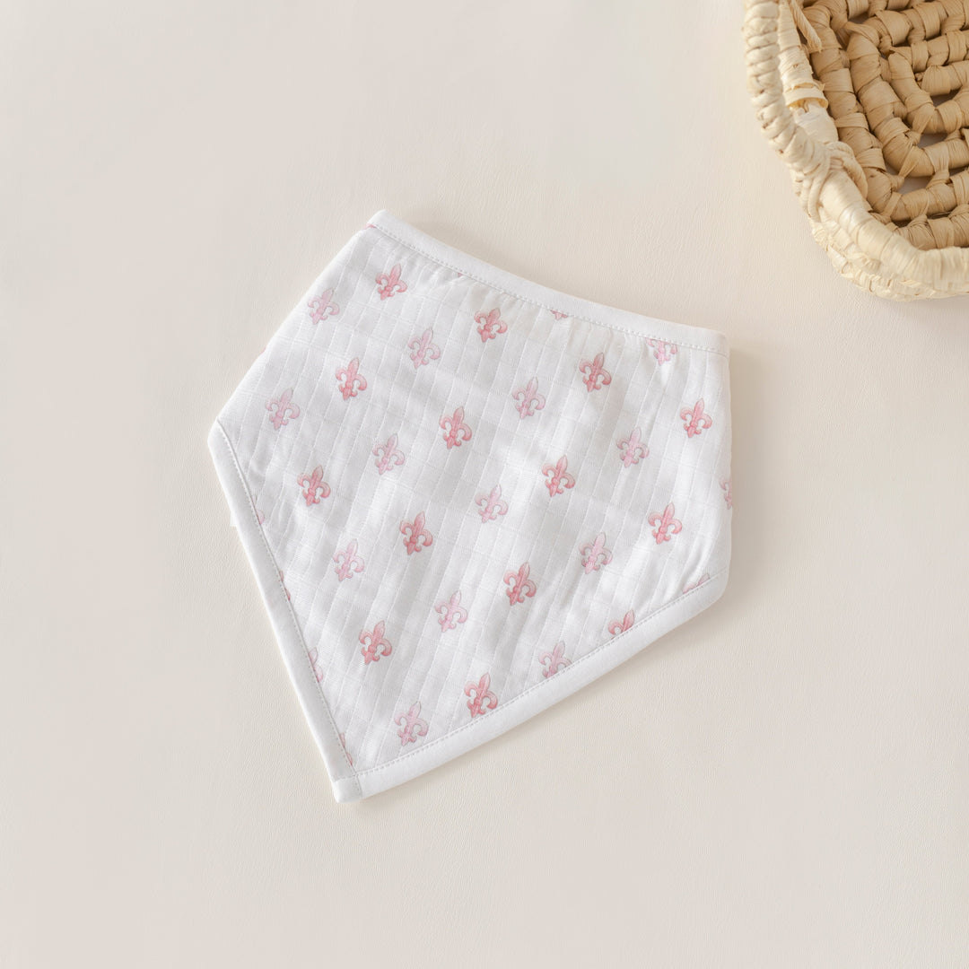 Fleur De Rose organic muslin bib in white with small pink rose pattern