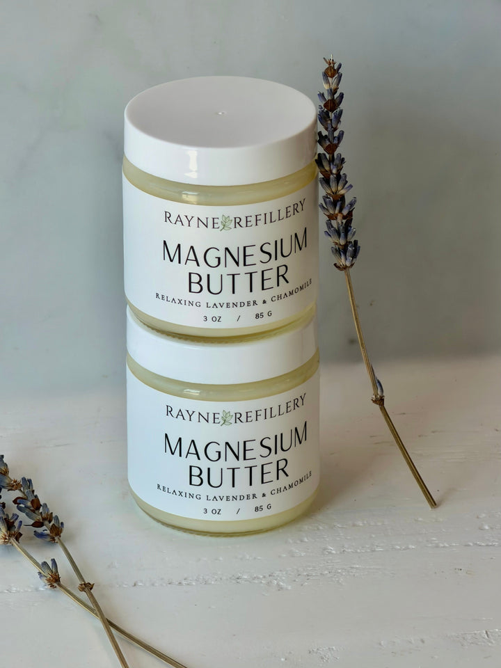 Magnesium butter skincare jars, two jars with white lids and beige label with lavender sprigs
