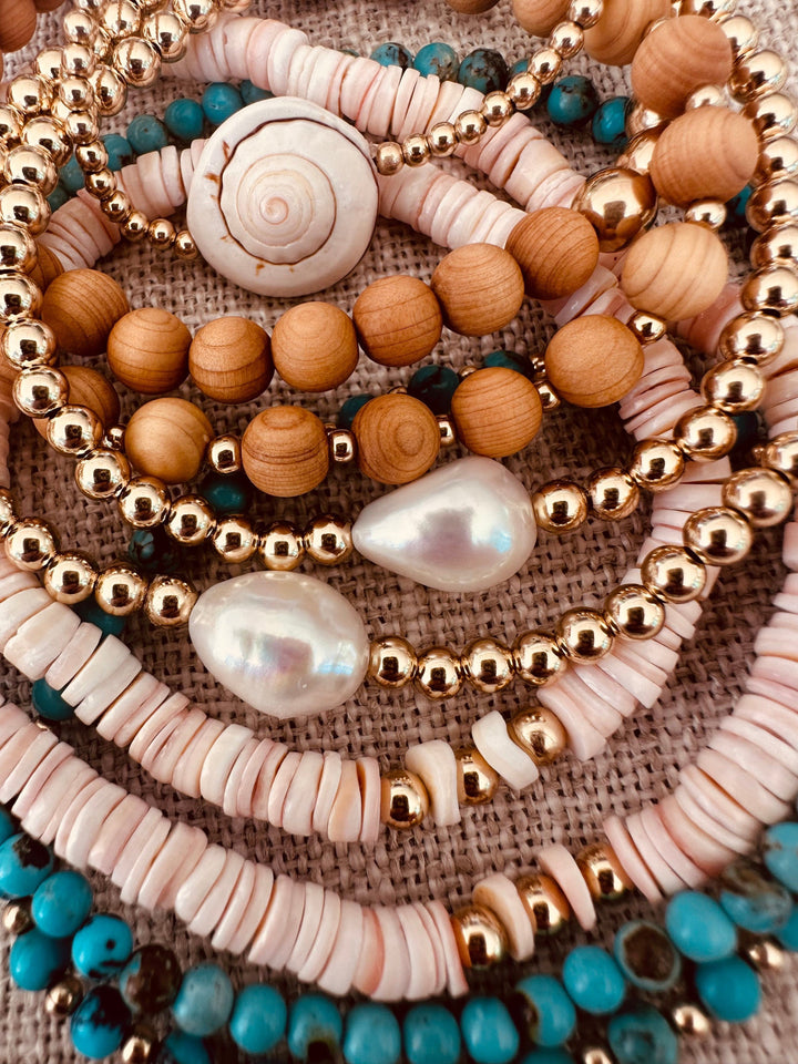 Beaded adult anklets with turquoise accents, gold-tone beads, and pearl-like shells