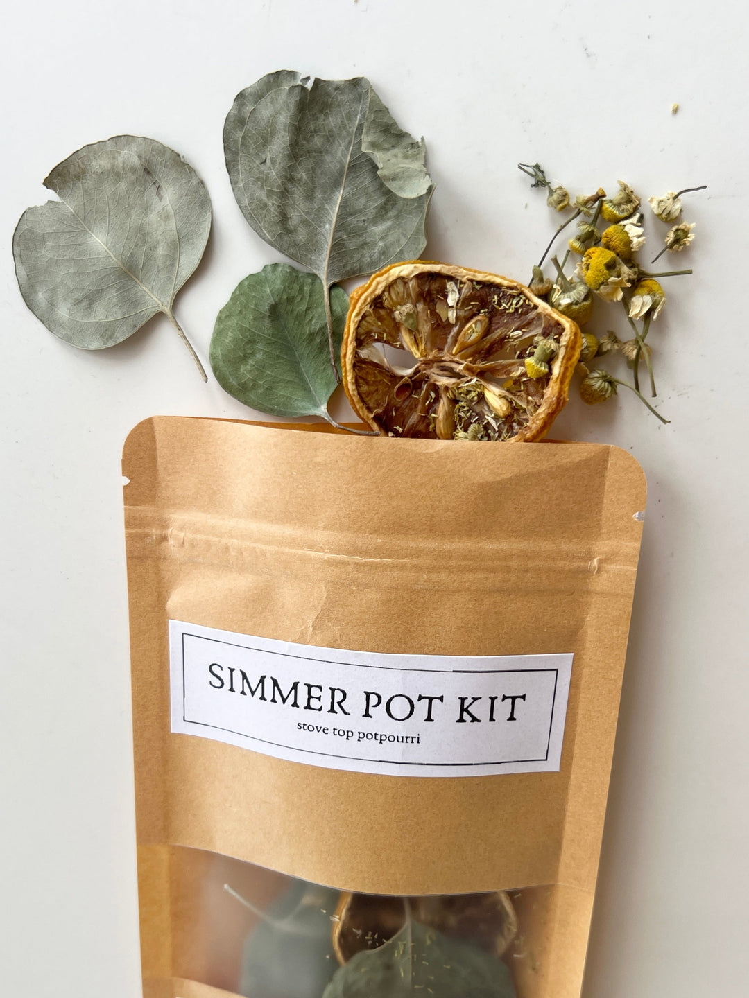 Simmer pot kit pouch with dried eucalyptus leaves and flower mix shown