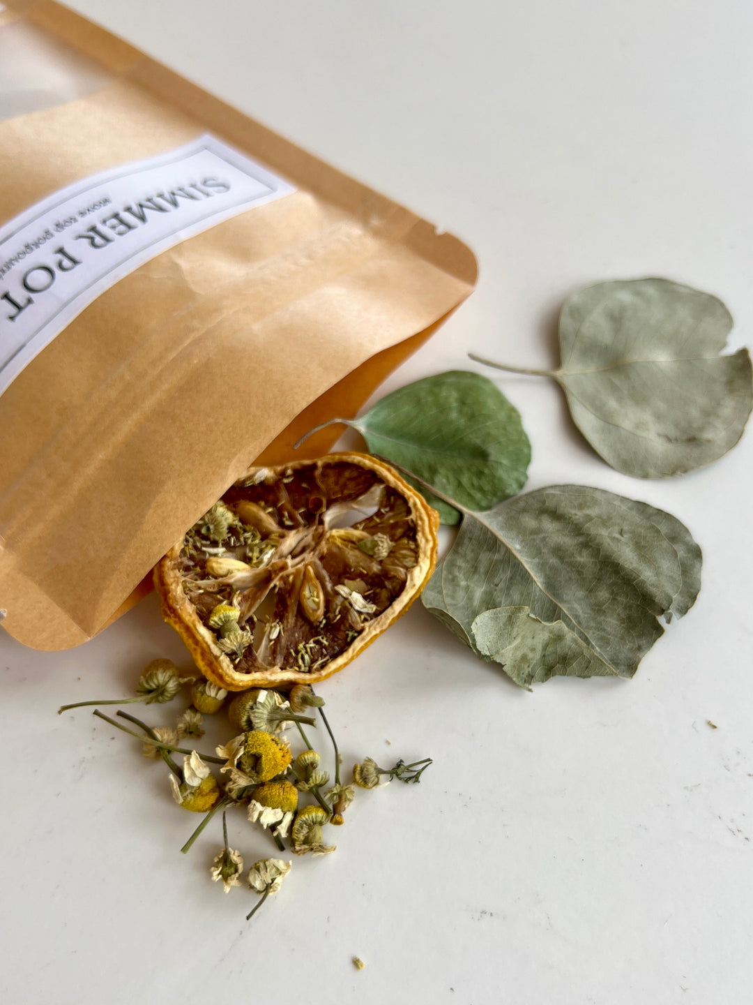 Eucalyptus simmer pot kit with loose dried leaves, flowers, and citrus slices