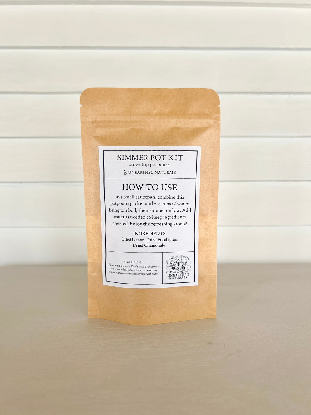 Simmer pot kit pouch with back instruction label on kraft paper