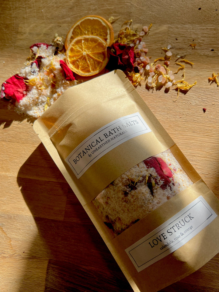 Botanical bath salts pouch with LOVE STRUCK label and dried citrus pieces