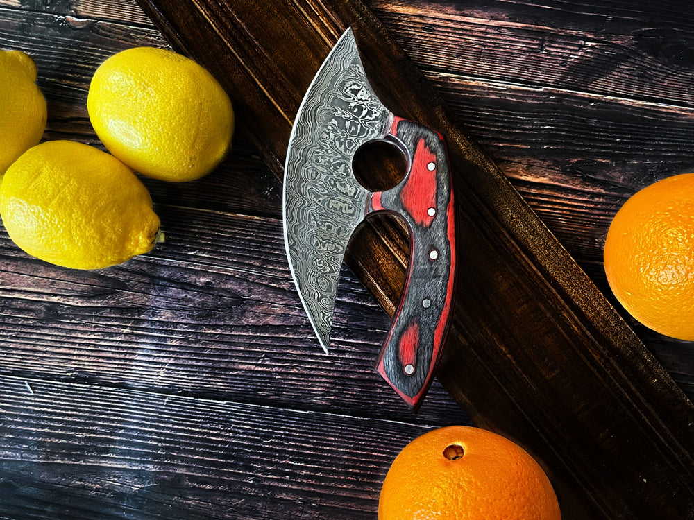 Ulu-style curved blade with etched steel and red-black wooden handle, angled view