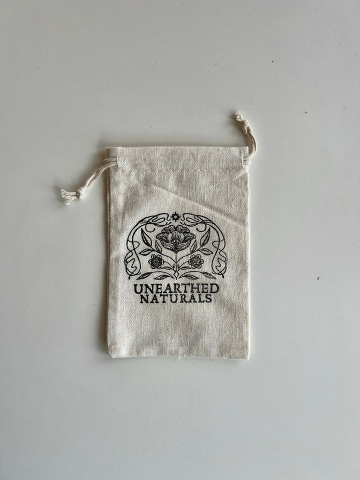 Reusable cotton muslin bath soak bag with drawstring, UNEARTHED NATURALS logo