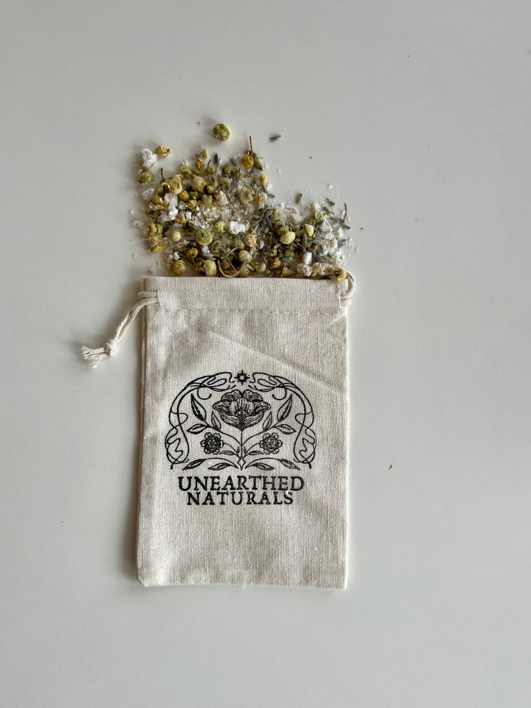 Reusable cotton muslin bath soak bag with drawstring, scattered herb mixture, UNEARTHED NATURALS