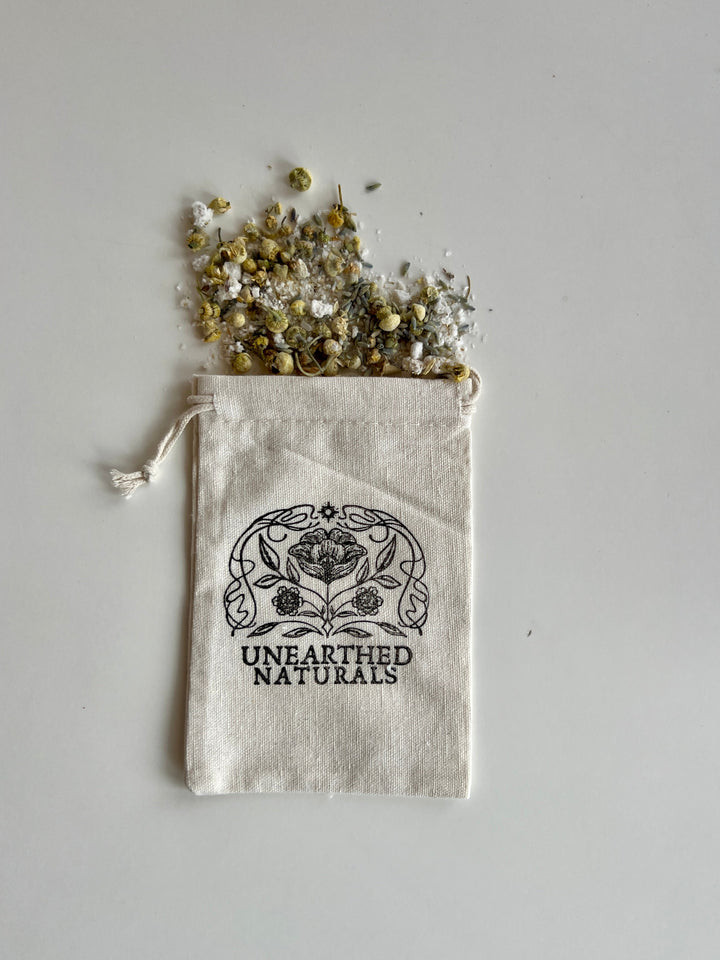 Reusable cotton muslin bath soak bag with drawstring, scattered herb mixture, UNEARTHED NATURALS