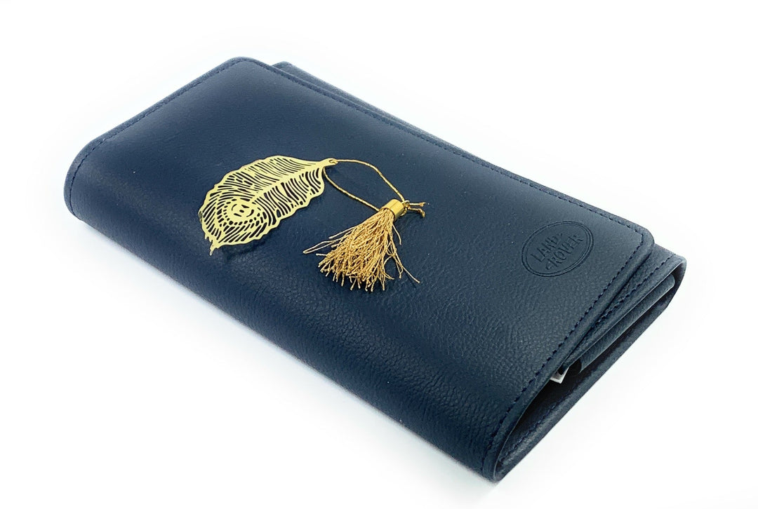 Feather bookmark with gold finish and tassel on dark blue cover