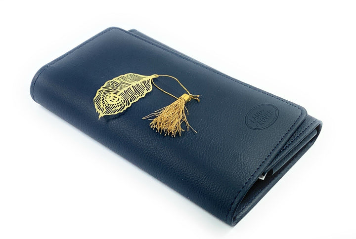 Feather bookmark with gold finish and tassel on dark blue cover