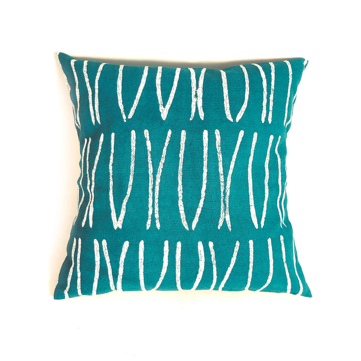 Teal pillow cover with white curved line pattern, rectangular shape